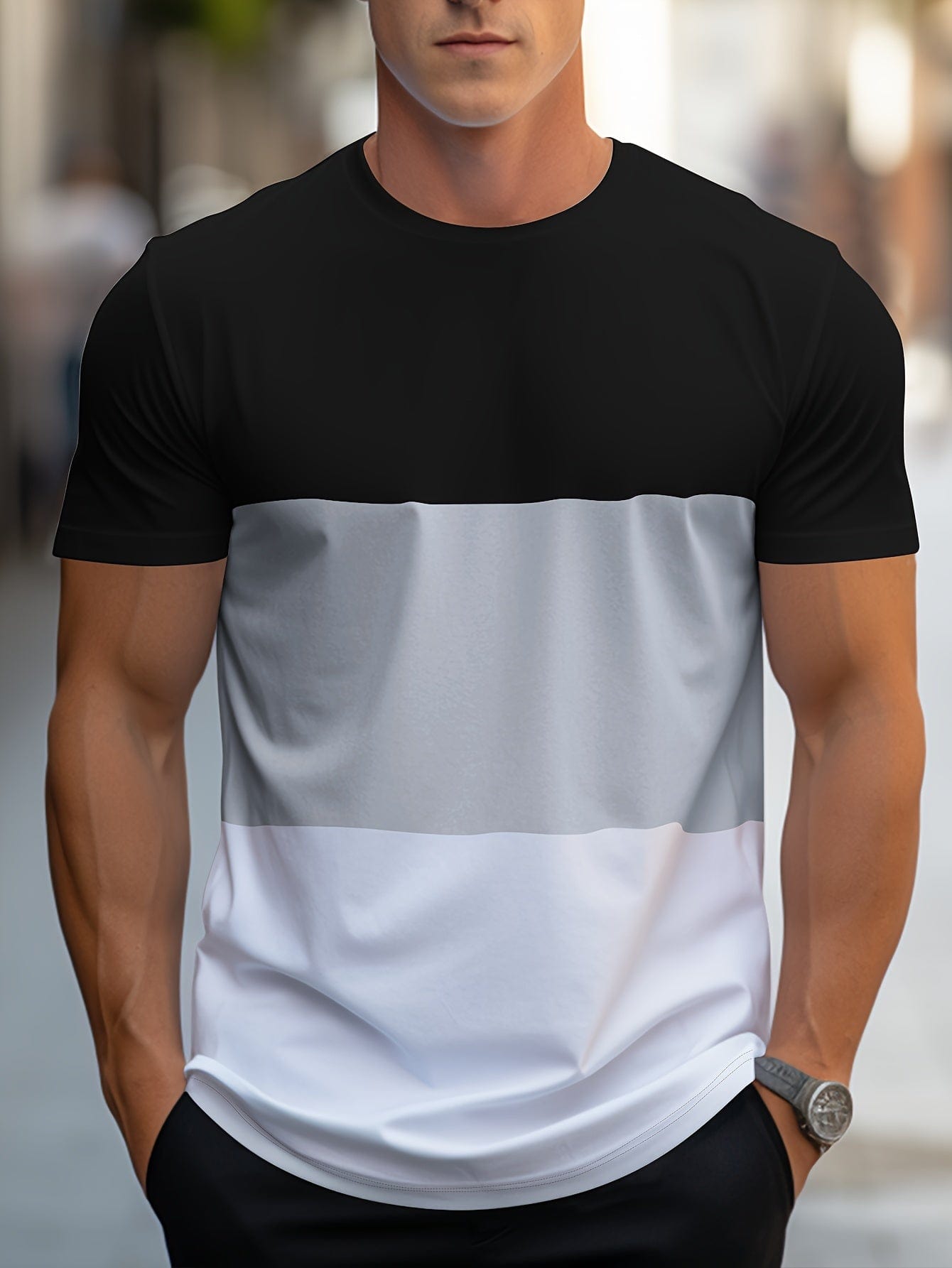 Mann trägt schwarz-grau-weißes T-Shirt, lässige Mode, Streetwear, Sommeroutfit.