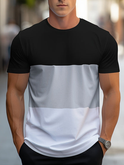 Mann trägt schwarz-grau-weißes T-Shirt, lässige Mode, Streetwear, Sommeroutfit.