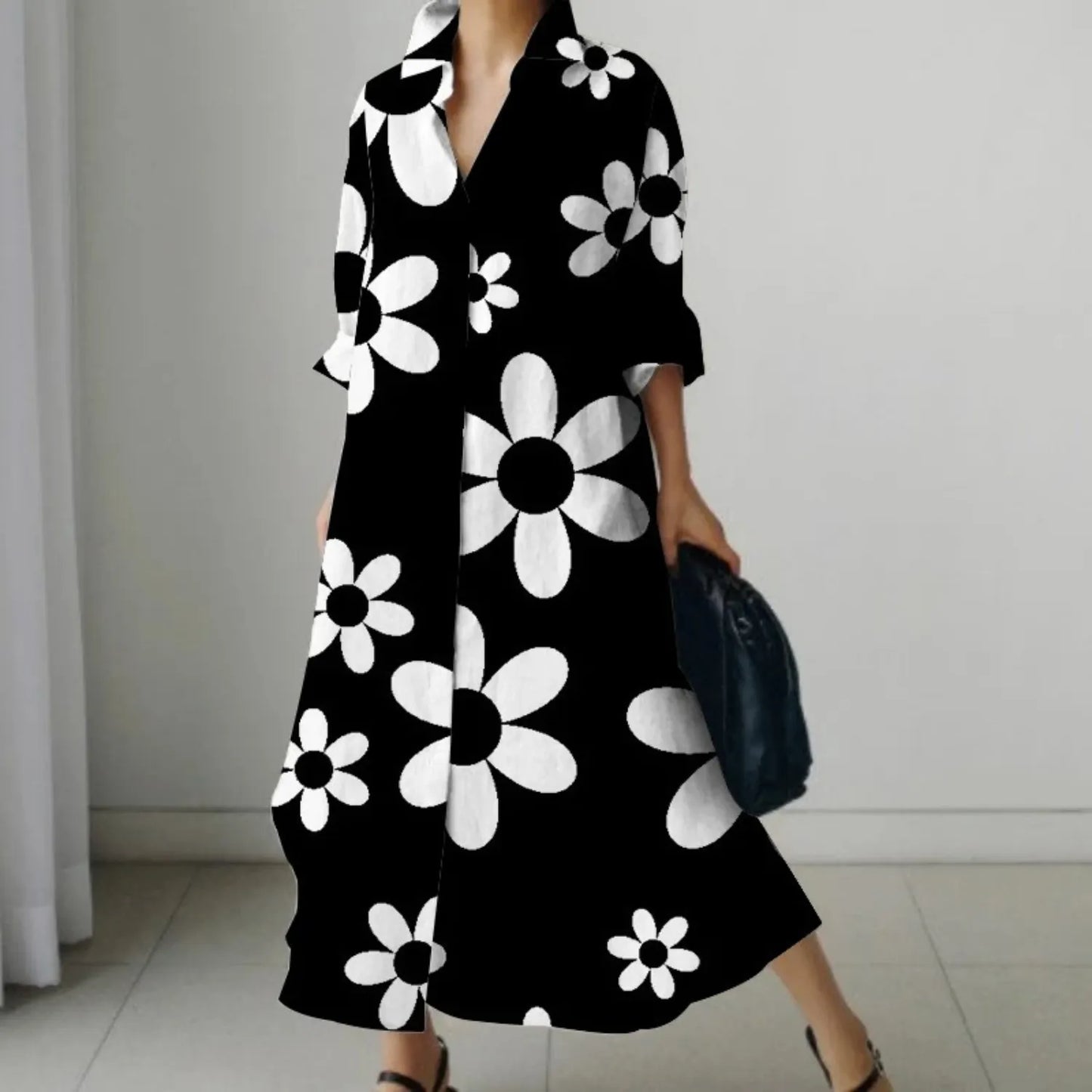 Schwarzes Maxikleid mit weißen Blumenmuster, eleganter Kragen, lange Ärmel, ideal für Frühling und Sommer. Modetrend, Damenmode, Blumenkleid.