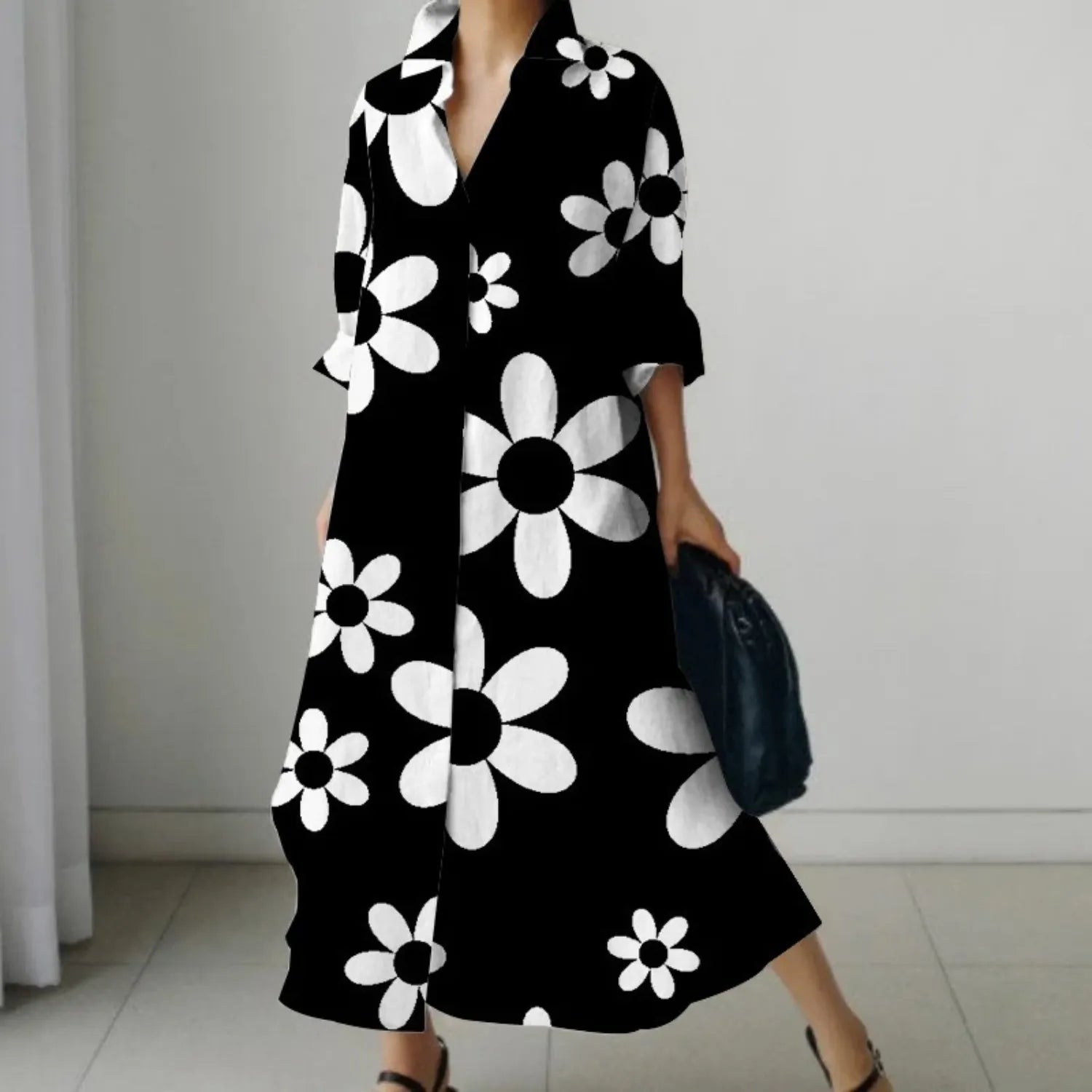 Schwarzes Maxikleid mit weißen Blumenmuster, eleganter Kragen, lange Ärmel, ideal für Frühling und Sommer. Modetrend, Damenmode, Blumenkleid.