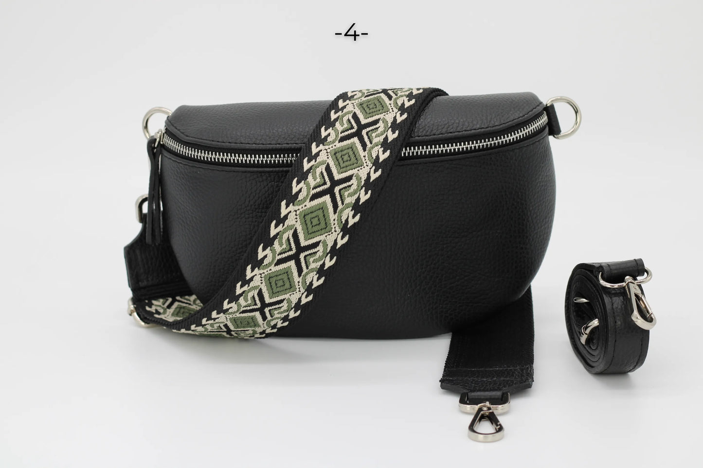 Schwarze Leder-Gürteltasche mit verstellbarem, gemustertem Riemen, ideal für stilvolle Aufbewahrung und Reisen. Perfekt für Damenmode.