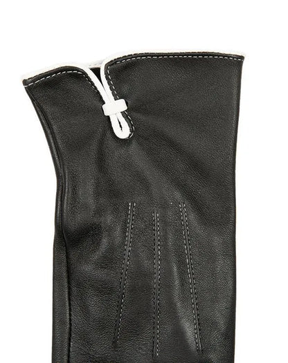 Schwarzer Lederhandschuh mit weißer Naht, elegantes Design, hochwertiges Material, ideal für stilvolle Wintermode und Accessoires.