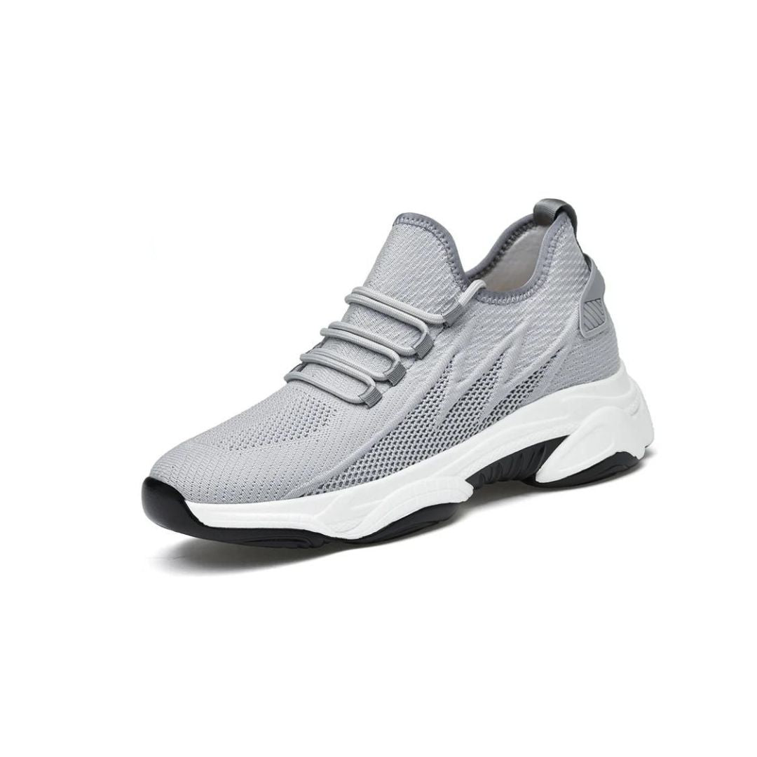 Grauer Sneaker aus Mesh, atmungsaktiv, mit weißer Sohle, modisch, sportlich, bequem.