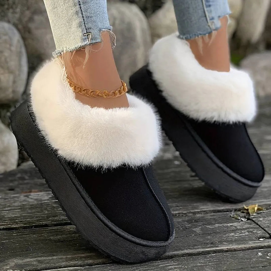 Schwarze Damen-Winterstiefel mit weißem Kunstfell, rutschfeste Sohle, ideal für kalte Tage. Modische, warme Schuhe für den Winter.