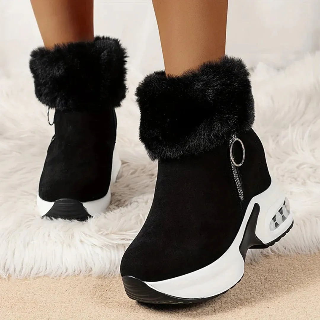 Schwarze Damenstiefeletten mit Kunstfell, Keilabsatz und Reißverschluss. Modische Winterstiefel, bequem und stilvoll für kalte Tage.