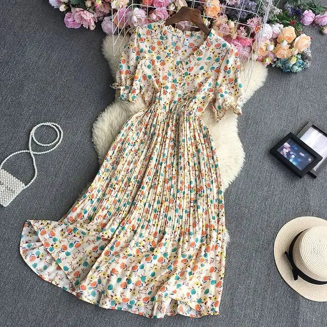 Blumenkleid mit buntem Blumenmuster, knielang, aus leichtem Stoff. Perfekt für Sommermode, Damenbekleidung, Freizeitkleidung, Boho-Stil.