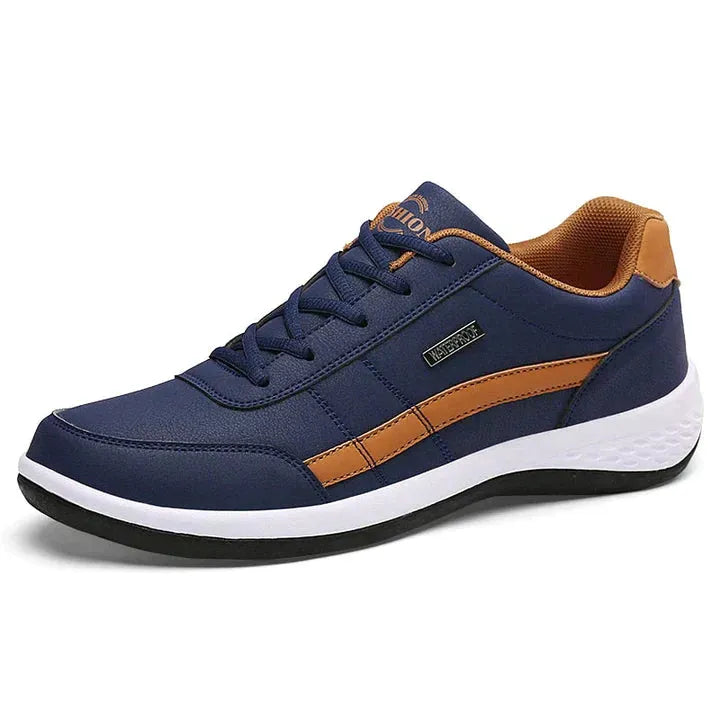 Dunkelblauer Sneaker mit braunen Akzenten, bequeme Sportschuhe für Herren, modisches Design, ideal für Freizeit und Sport, rutschfeste Sohle.