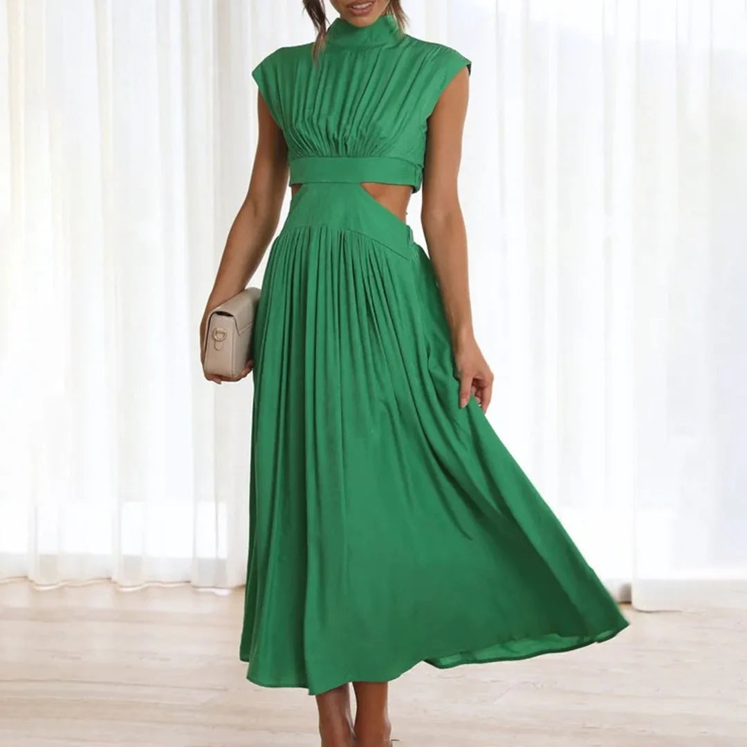 Elegantes grünes Maxikleid mit Cut-Outs, ärmellos und fließendem Stoff. Perfekt für Sommermode, Abendveranstaltungen und stilvolle Anlässe.