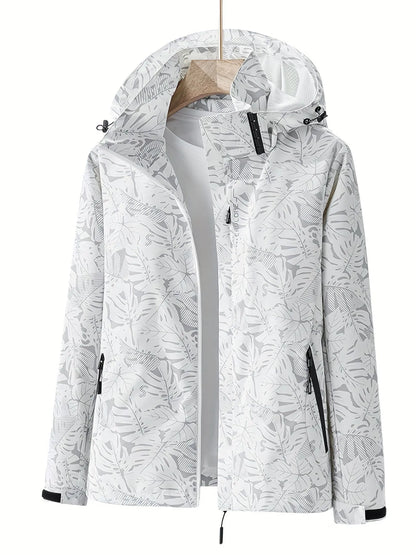Weiße Damenjacke mit Kapuze, floralem Muster und Reißverschlusstaschen. Perfekt für Outdoor-Aktivitäten. Modische, funktionale Damenbekleidung.