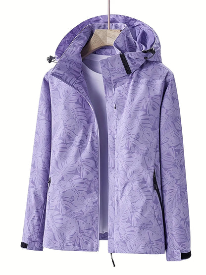 Damen Outdoorjacke lila mit Kapuze, wasserabweisend, atmungsaktiv, ideal für Wandern und Freizeit. Modisches Design mit floralem Muster.