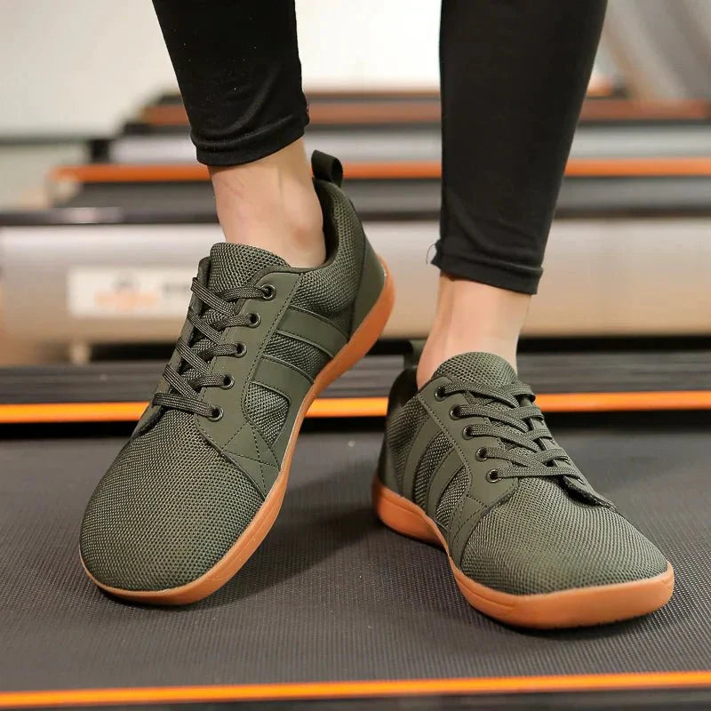 Grüne Barfuß-Sneakers für Damen, atmungsaktiv, mit Gummisohle, ideal für Freizeit und Sport.